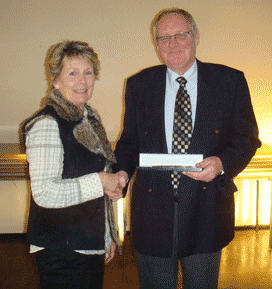 Mr Geoff Gatenby being presented, by Christine Beardsell, a thank you gift at our 2008 AGM